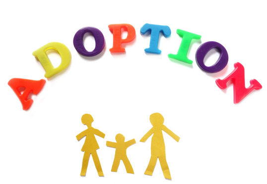 adoption – Paper family of three with Adoption spelled out in play letters