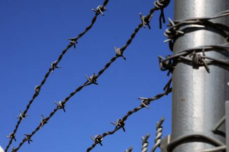 barbed-wire-fence prison