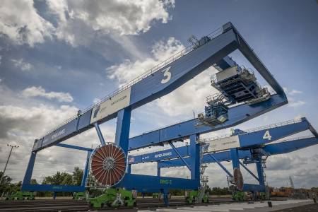 The first of Nine Rail Mounted Gantry Cranes starts to work at the Mason Mega Rail Terminal at the Port of Savannah