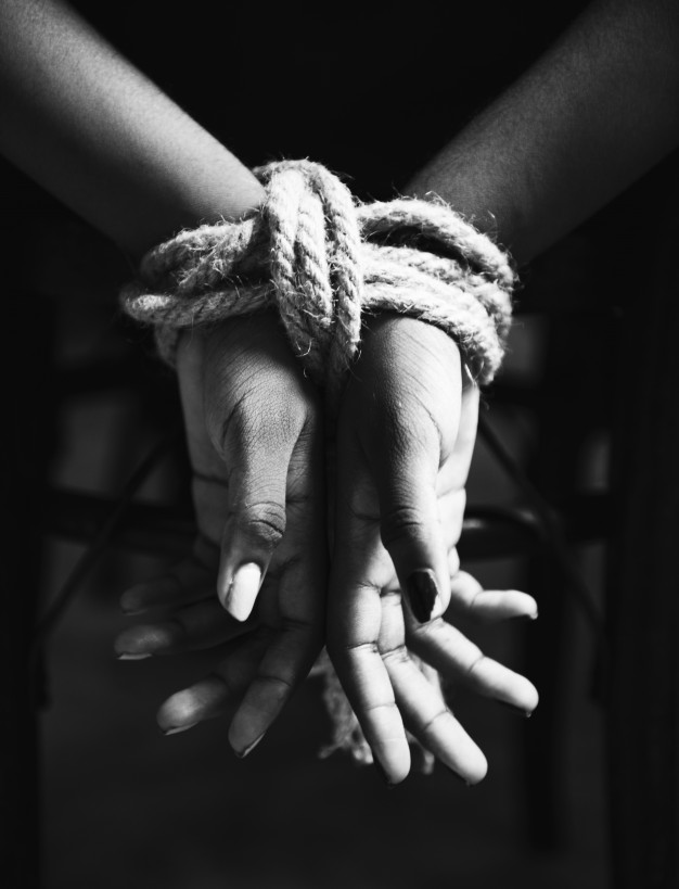 kidnap hands-tied-with-rope-around_53876-15327