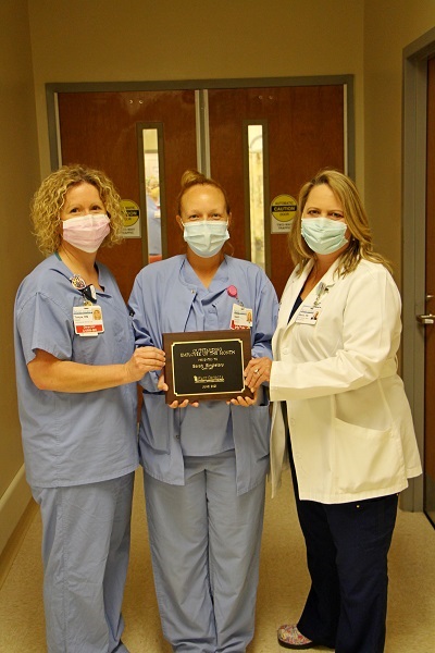 Director of Cardiovascular Services at EGRMC Tonya Eagle, Employee of the Month Sarah Singletary, and Chief Nursing Officer Marie Burdett