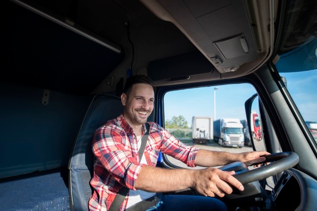professional-truck-driver-casual-clothing-wearing-seat-belt-driving-his-truck-destination_342744-1267