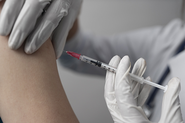 vaccine arm syringe