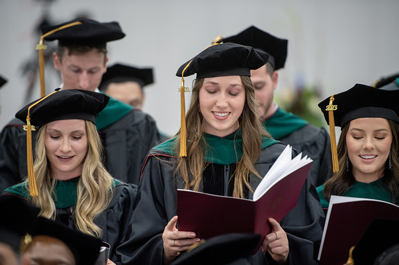 Graduates recite their professional oath
