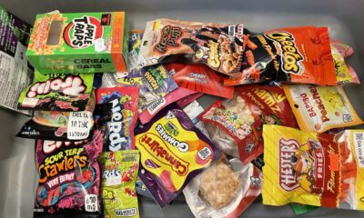 Attorney General Jason Miyares displayed a bin of THC edible products from Virginia stores. Experts say the products have caused a spike in poison control calls involving young children and teens. (Photo by Graham Moomaw)